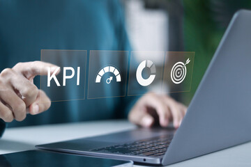 KPI, business performance indicators. make report with KPI and metrics, finance, operations, sales, marketing. Businessman use laptop with virtual icon.