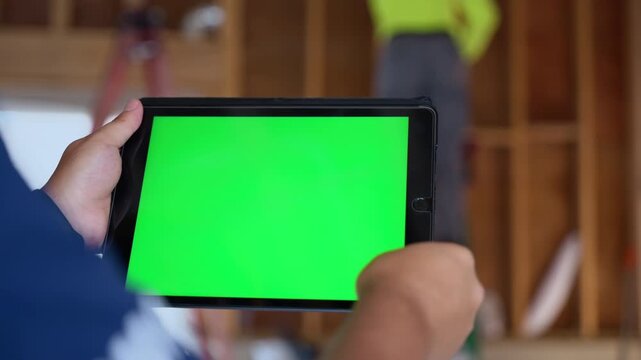 Engineer using his tablet at Home Renovation, repair or construction process. Camera move