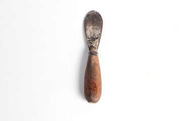 Rusty putty knife carpentry tool isolated on white background