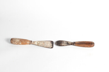 Rusty putty knife carpentry tool isolated on white background