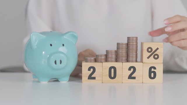 2026 New year with percentage change to UP and Down arrow with coin stack. Interest rate, GDP, stocks market, financial, deflation and Inflation, mortgage, debt, Loan and Economic Recession