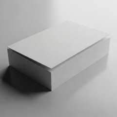 Fototapeta premium A simple white rectangular box with a lid casting a shadow isolated on white background