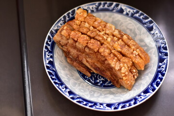 Crispy fried pork on white plate, Delicious glazed pork belly with crispy skin, Crispy Pork
