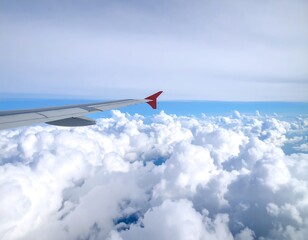 Fototapeta premium Airplane wing above clouds, travel, sky