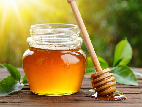 Golden honey in a jar, a natural and pure sweetener.