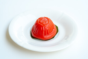 Ang ku kueh, also known as red tortoise cake, is a small round or oval-shaped Chinese sweet dumpling with soft, sticky glutinous rice flour skin wrapped around a sweet central filling