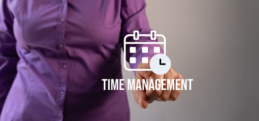Time management: a woman pointing at an icon of a calendar with a clock