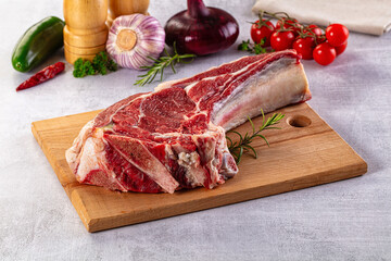 Raw prime beef steak with bone