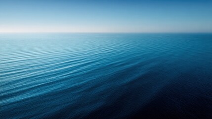Obraz premium Oceanic Serenity: An ethereal capture of the endless ocean, where the vast expanse of water meets the sky at the horizon, creating a minimalist seascape of pure tranquility and peace.