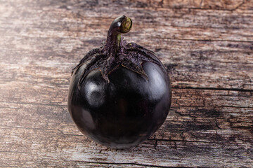 Raw round black big eggplant