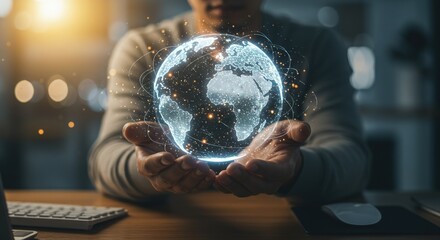Person holding a glowing digital earth in their hands