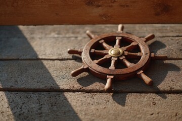 Obraz premium Vintage ship wheel on rustic wooden planks in sunlight