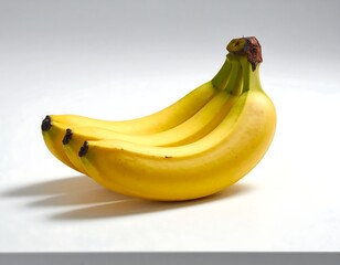Bunch of ripe bananas on a white surface