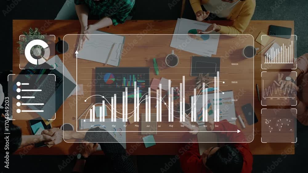 Aufkleber a business team works together around a table analyzing data with digital graphs and charts in a mod