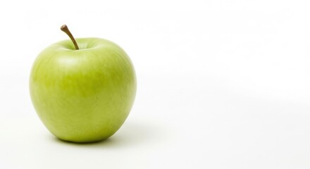 Single green apple on a plain white background