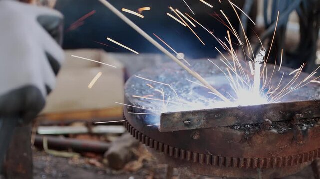 Track Shot Zoom Side View Construction Industrial Factory or Metalwork Concept by Mechanic or Technician Welder Welding Steel