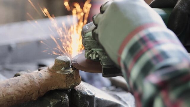 Zoom Back View Construction Industrial Factory or Metalwork Concept by Mechanic or Technician Using Grinder with Ball Joint Auto Part