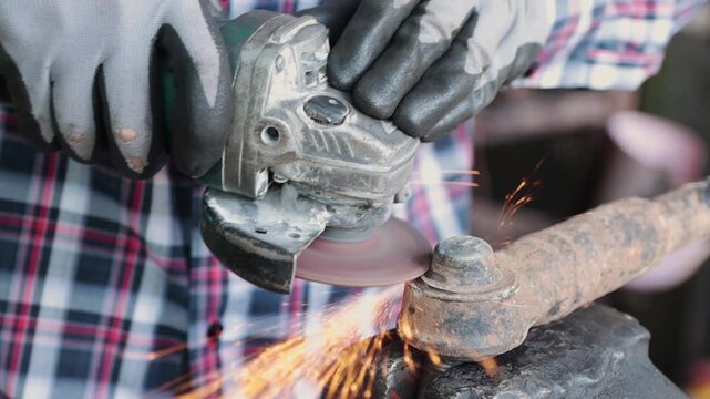 Zoom Front View Construction Industrial Factory or Metalwork Concept by Mechanic or Technician Using Grinder with Auto Part Workshop