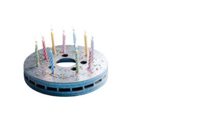 A stylized, circular cake with candles, resembling a disc