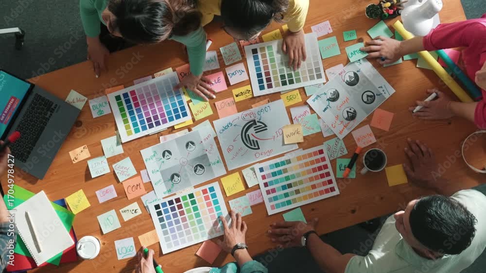 Poster top down view of designer compare color palettes with laptop and design product. aerial view of mark