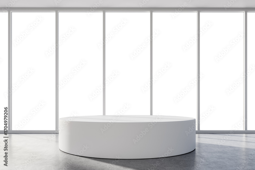 Poster minimalist white circular display podium in bright showroom with large vertical windows, showcasing 