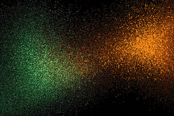 Obraz premium Green and orange sparkling dust field on black