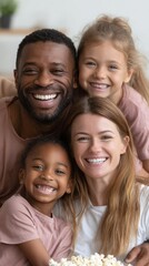 Obraz premium Happy family enjoys time together at home with children in casual clothes, sharing smiles and laughter in a cozy living room