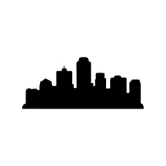 Naklejka premium A silhouette of a modern city skyline with tall buildings against white