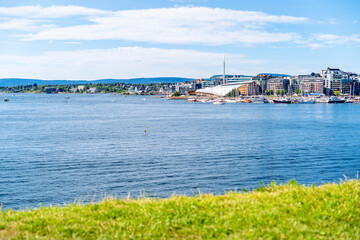 Fototapeta premium Oslo Harbor with ships and famous Opera House. Coastal capital Norway with fjords and modern architecture.