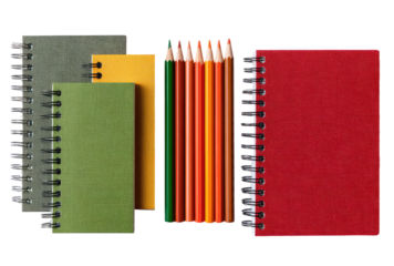 Assorted spiral notebooks and colored pencils