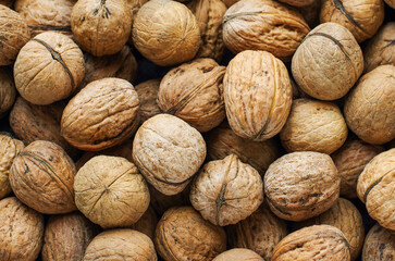 Top view of whole walnuts as background texture