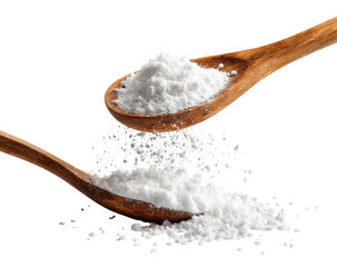 Two wooden spoons overflowing with white powder, some scattering