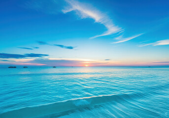 Obraz premium Vibrant blue ocean waves under a colorful sunset sky