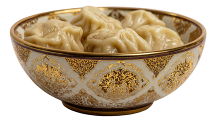 Several dumplings in a decorative bowl.  A light beige bowl with gold trim and ornate pattern holds a few uncooked dumplings, a pale yellowish-tan color