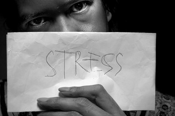 Stress Written on Paper Held in Hand – Expression of Sadness and Depression