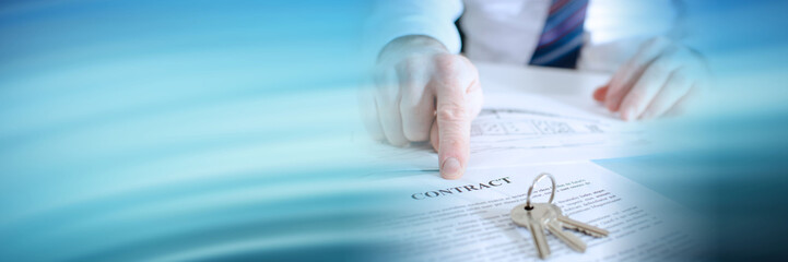 Estate agent showing a contract; panoramic banner