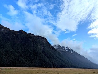 Majestic Mountains and Cloudy Skies in New Zealand's Stunning Scenery