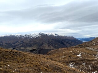 Snow-Capped Mountain Range in New Zealand on a Cloudy Day