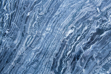 The pattern and surface of the blue, white and black marble walls for the background and tile design.