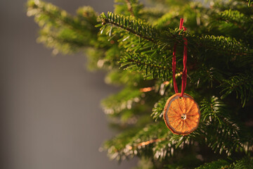 Closeup small christmas tree with natural decorations indoor