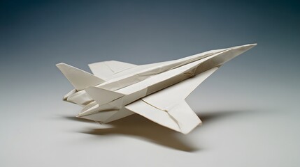 Paper airplane isolated on a white and blue background.