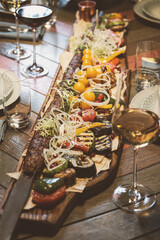 Indulge in a Gourmet Charcuterie Board featuring Grilled Fresh Vegetables