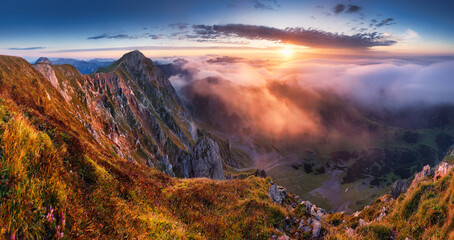 Alpine mountain panorama landscape at dramatic sunrise at Eisenerzer Reichenstein and hut in...