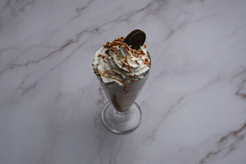 Indulge in a delicious Chocolate Sundae topped generously with Whipped