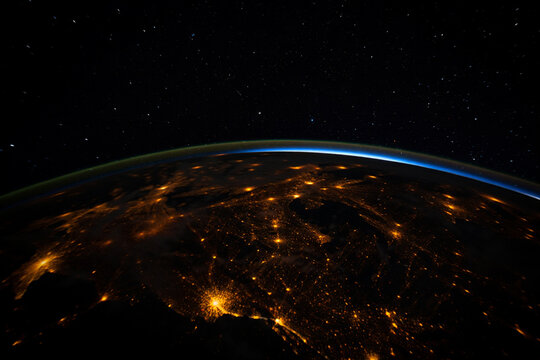 Experience the vibrant glow of cities from above at night.