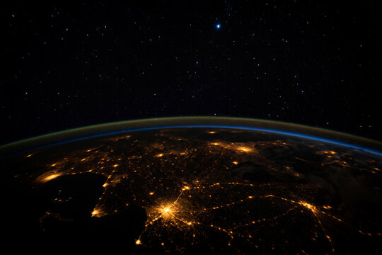 Experience the vibrant glow of cities from above at night.