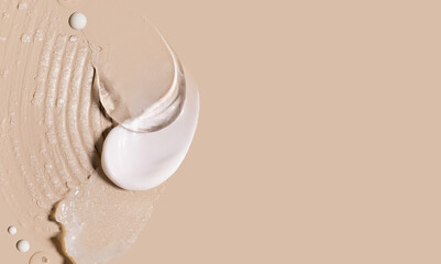 samples of cosmetic care products smear of cream gel texture on a beige background, moisturizing and skin care concept