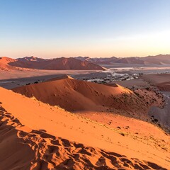 Sunrise over red desert dunes