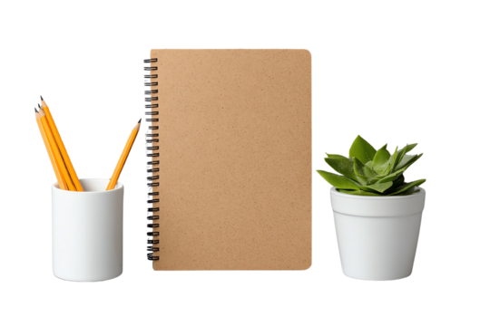 A minimalist workspace featuring a notebook, pencils, and green plant for a fresh ambiance.