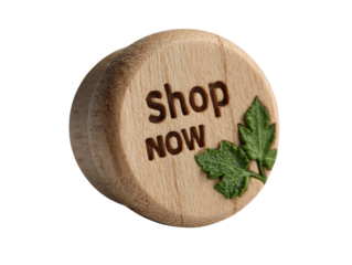 Artisanal wooden button with 'Shop Now' inscription and delicate green leaf accents on transparent